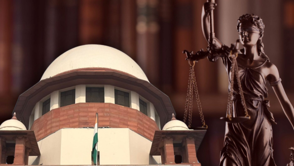 The Supreme Court building with the Indian flag in front, alongside a statue of Lady Justice holding scales.
